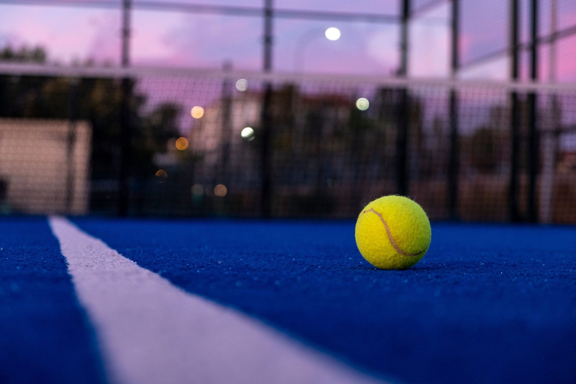 Tennis ball on a paddle tennis court at nightfall